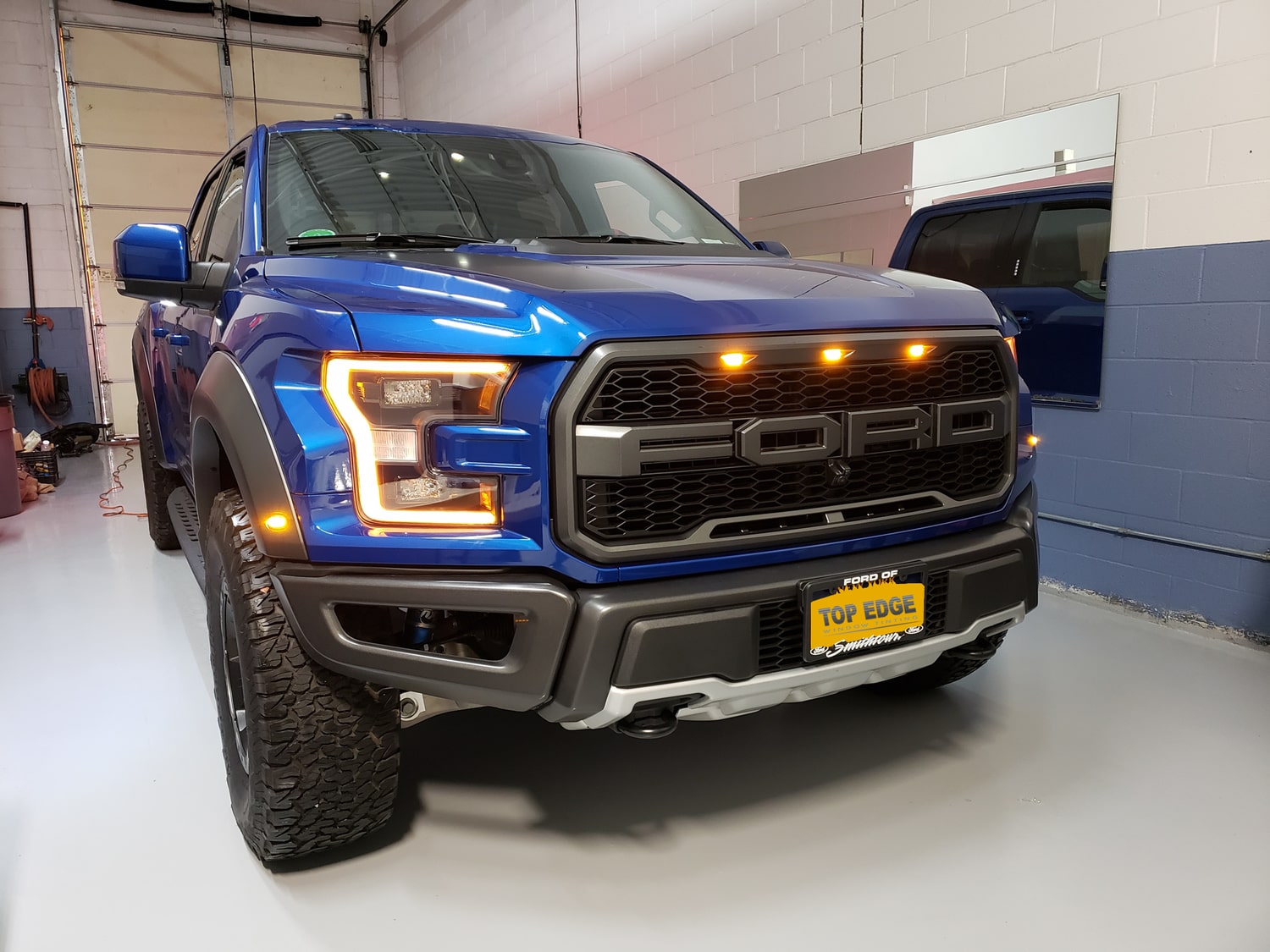 ford raptor blue with lights on